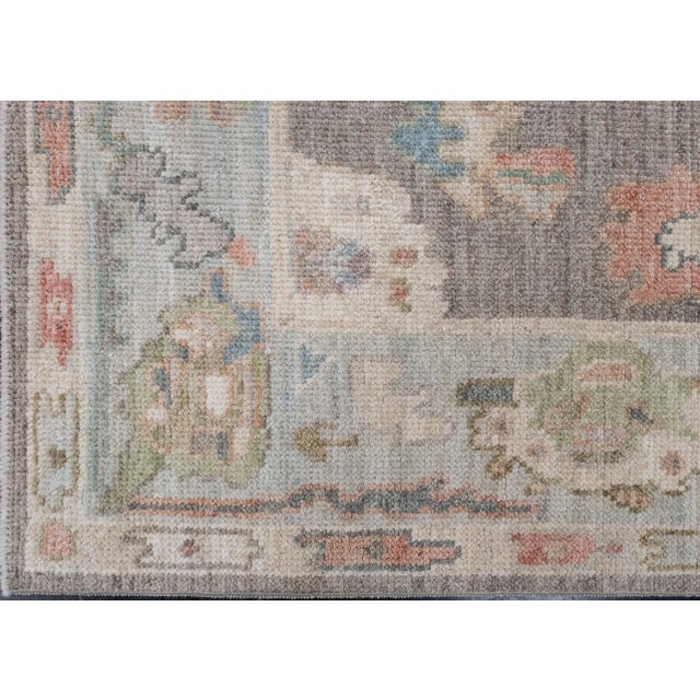 Turkish Oushak Rug Gray Multi Color Hand Knotted Wool Rug 4' X 6'1" Bring timeless character into your space with this...
