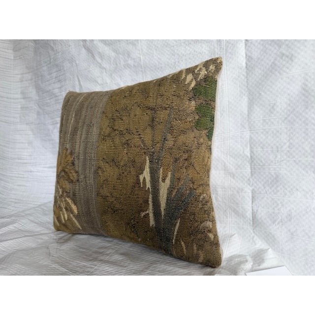 This 17th century Brussels tapestry pillow features a classic Baroque pastoral composition depicting a stylized woodland...