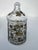 Vintage glass jar featuring a hand-painted medieval or gypsy-style motif. The clear glass jar is decorated with gold and...