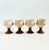 A set of 4 vintage studio pottery goblets. Each with a speckled off white bowl and terra cotta stems. Each measures...