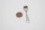 This is an adorable silver salt cellar spoon. It has small leaf detailing on the handle. Marked 800 crescent moon and...
