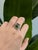 A watermelon tourmaline rests in bands of pink and green at the centre of this solid 14K white gold ring, encircled by...