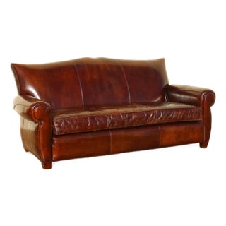 Vintage Art Deco Distressed Brown Leather Three-Seat Sofa With Mustache Back For Sale