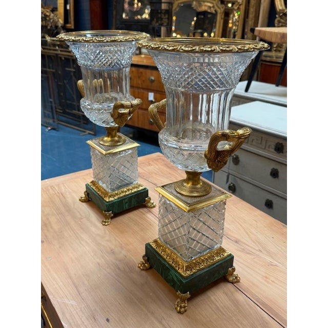 This product is a stunning pair of French crystal and bronze vases standing elegantly on malachite bases. The elegant...