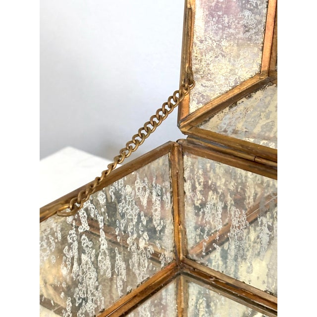 Vintage mirrored mercury glass lidded box with brass edge, the attractive way to hide mundane household items. Box stands...