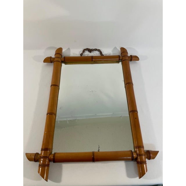 A fine hand carved antique French Faux Bamboo Wall Mirror, circa early 1900s. Made in France. This gorgeous rich reddish...