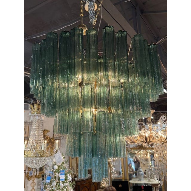 The Modern Green Murano Glass "Trochi" Chandelier is a stylish and elegant lighting fixture designed for modern homes....