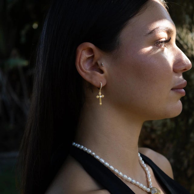 Elevate your style with the timeless elegance of the Divine Spark Cross Gold Vermeil Earrings. These dazzling earrings are...