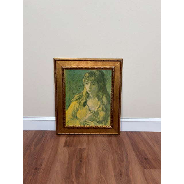 Vintage framed portrait depicting a contemplative woman in a yellow garment, presented in an ornate gold-toned molded...