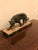 Art Deco signed Meland White metal panther statue in black finish, mounted to Portoro marble base. One corner of the...