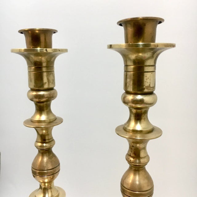 Solid brass and nicely turned, these two candlesticks have a warm, golden patina. Includes two candle chasers. Dimensions:...