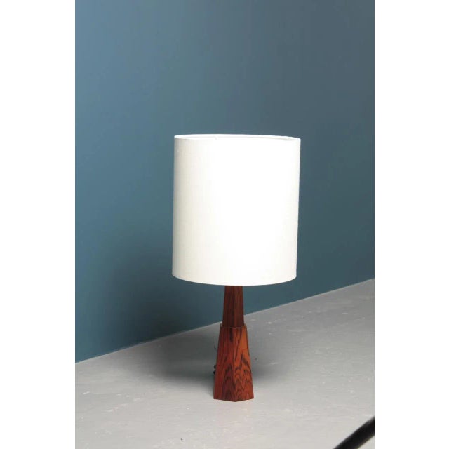Decorative table lamp in rosewood designed and made in Denmark. Great original condition. European Plug (up to 250V).The...