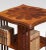 Mahogany revolving bookcase the inlaid shaped top above an arrangement of shelves and slat supports raised up on a...