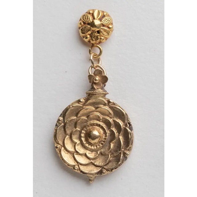 18K gold, hand cast drop earrings with a subtle floral motif. Originally old Indian pendants from a necklace. The 18K gold...