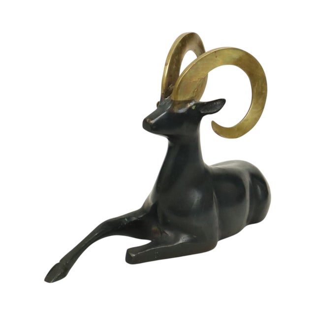 Vintage Art Deco style statue or sculpture of a reclining ram, made of patinated brass, a mid-century modern design object...