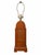 A sculptural vintage table lamp featuring a warm brown wooden body with an arched top, a framed woven cane inset, and a...