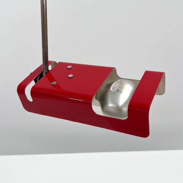 Red Spider Desk Lamp by Joe Colombo for Oluce, 1970s, in Good conditions. Designed 1960 to 1969 This piece has an...