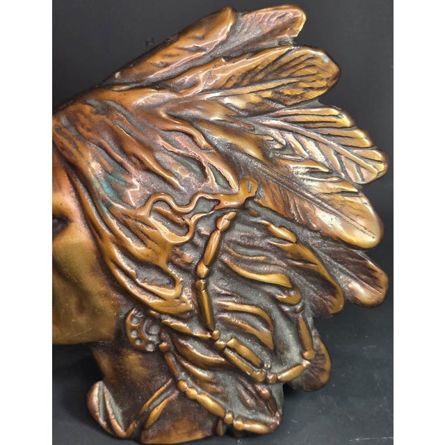 I’m selling an early 1900’s antique bronze plaque, shaped like a realistic left-facing profile of a Native American Indian...