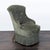 This elegant lounge chair features a soft green velvet upholstery with a comfortable, curved backrest and button-tufted...