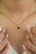 This elegant solitaire pendant features a 0.65 carat heart-shaped blue sapphire, set in 14k yellow gold. measuring 4.6 x 5...