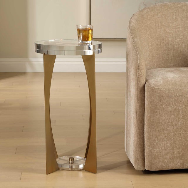 This Elegant Accent Table Features A Striking Brass Finished Iron Base With A Unique, Open-frame Design. The Metalwork Is...