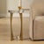 This Elegant Accent Table Features A Striking Brass Finished Iron Base With A Unique, Open-frame Design. The Metalwork Is...