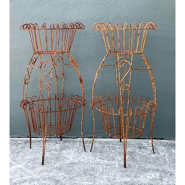 This striking pair of vintage wire plant stands captures the effortless charm and romantic elegance of French Country...