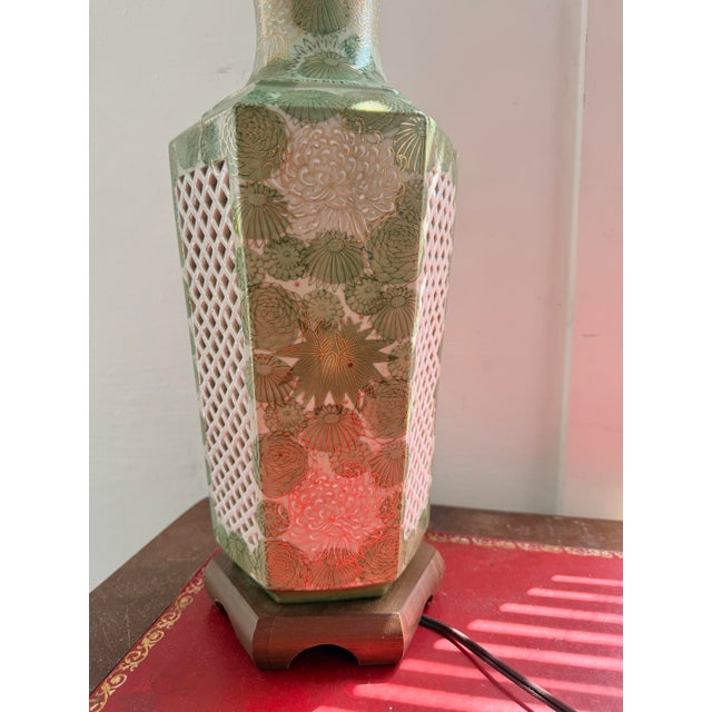 A striking mid-century Japanese Kutani porcelain table lamp with a hexagonal form and exceptional hand-painted decoration....