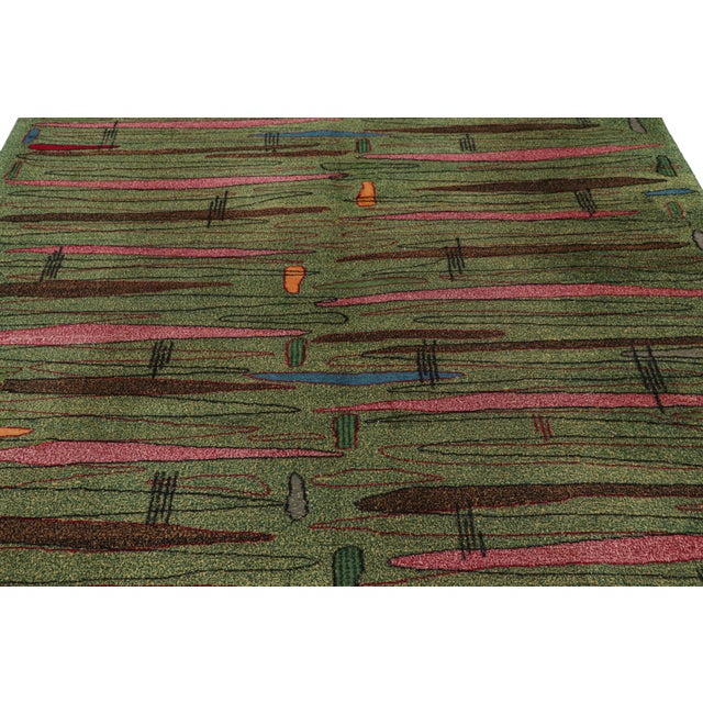 Hand-knotted in wool, this 7x9 vintage rug originating from Turkey, circa 1960-1970, is a very special piece, featuring a...