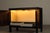 A compact brutalist bar cabinet designed by jean batenburg for mi, belgium, during the 1960s. executed in solid oak with a...