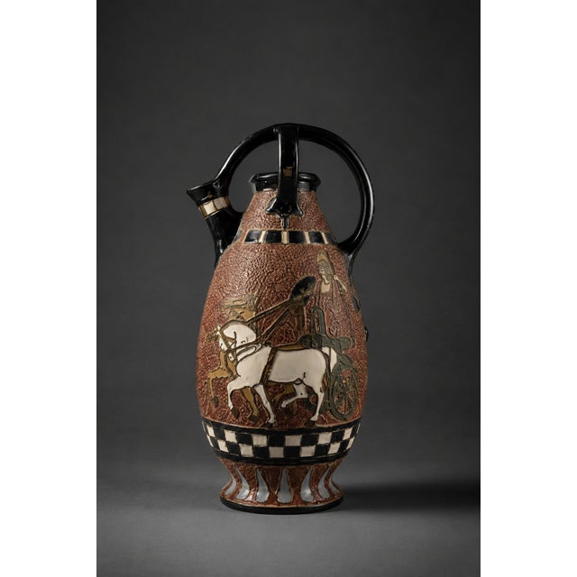 A rare bohemian secession ceramic amphora, circa 1915, distinguished by an elaborate raised glaze decoration and an...
