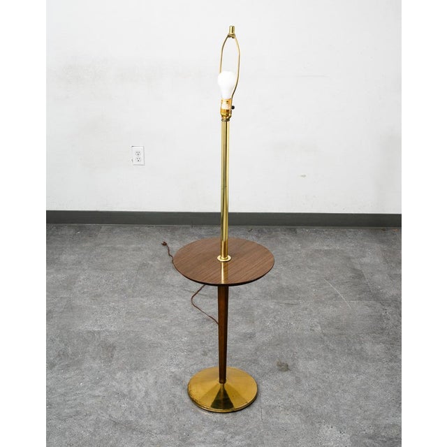 Table floor with side built in round table in brass and laminated top surface. American made C 1970s.