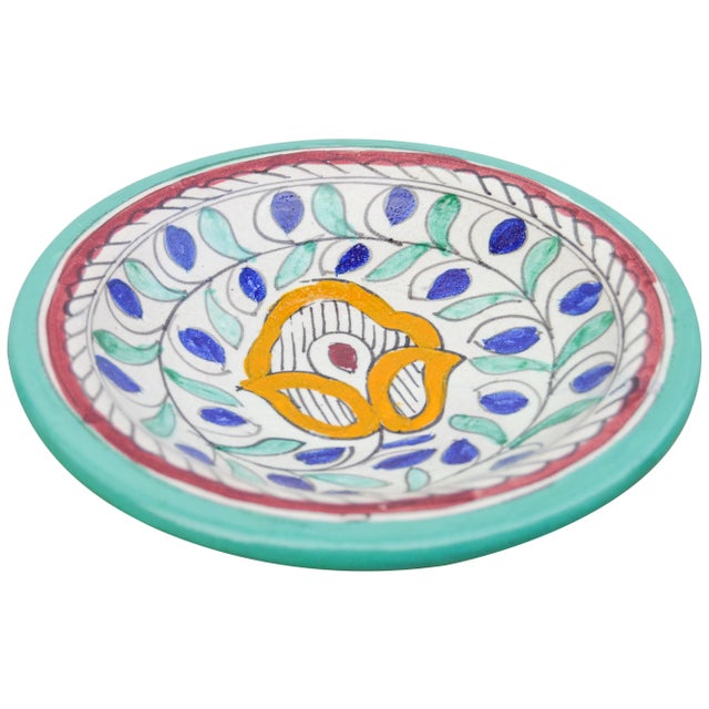 Handcrafted and glazed ceramic plate made in Fez, Morocco. Exhibits an intricate hand-painted Moorish pattern in a...