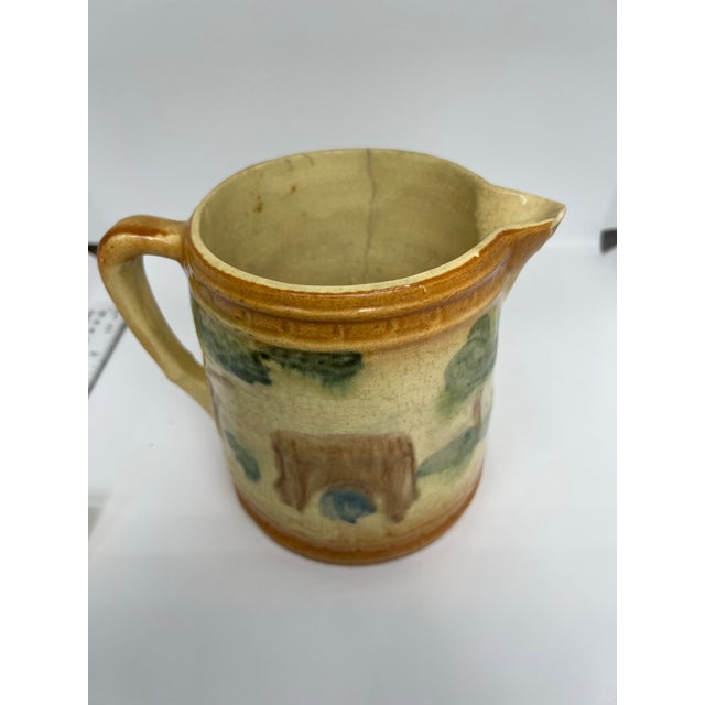 Early 1900s pitcher by Roseville Pottery.