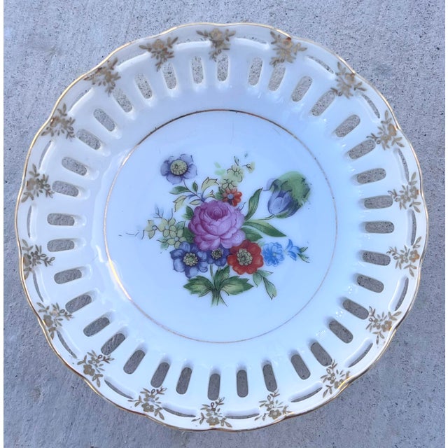 A collected 11-piece plate wall spanning from the late 19th century to the present day. Soft whites, whispers of lavender...