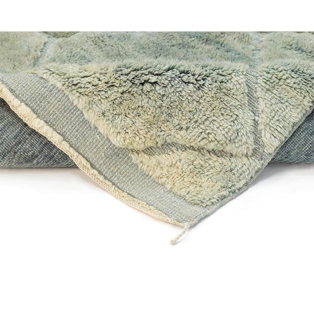 A tranquil field traced with quiet geometry. Soft diamond lines in muted seafoam trace across a tranquil sage green field,...