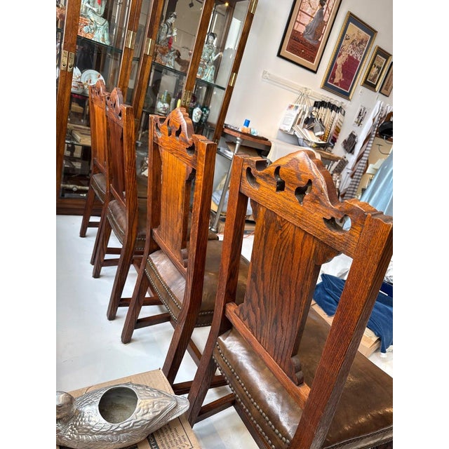 Early 20th Century Set of 4 - Antique Gothic Revival Carved Oak Hall Chairs - Leather Seat Nailhead For Sale - Image 5 of 8