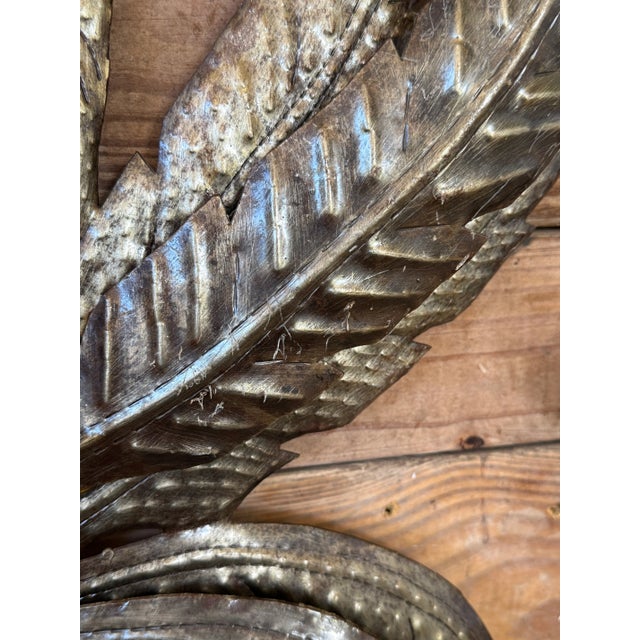 Pair of striking hand-hammered wall sculptures crafted in Haiti from repurposed steel oil drums — a celebrated folk art...