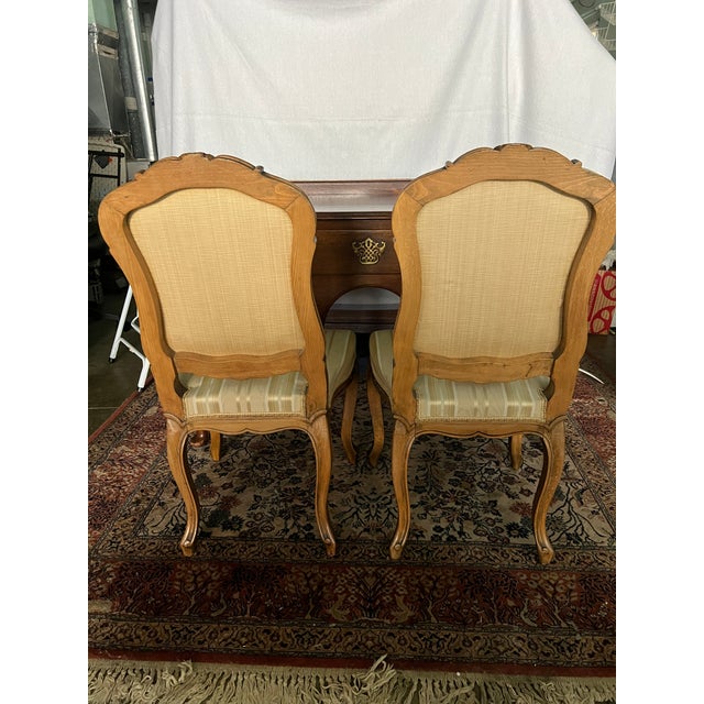 My favorite French Chairs covered in Silk Fabric, Water Mark pattern. Chairs are solid are really well made, yes have been...