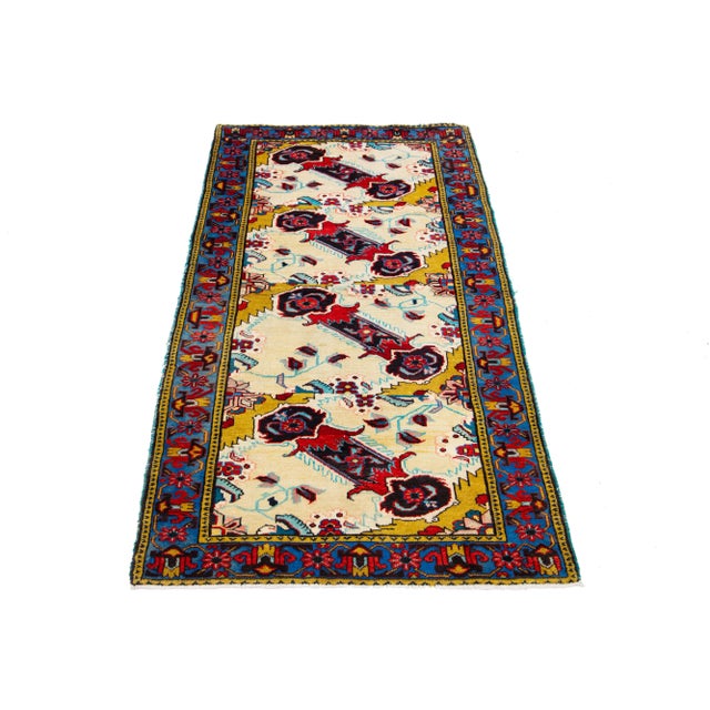 Beautiful Vintage Shiraz Hand-knotted wool rug with a beige field. This rug has a multicolor accent in allover the design....