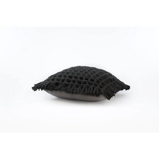 The Honeycomb cover pillow in black is made of recycled cotton and linen from the waste of home textile products. As all R...