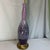 Add a gorgeous pop of atomic-era color to your space! This stunning mid-century modern table lamp features a beautiful...