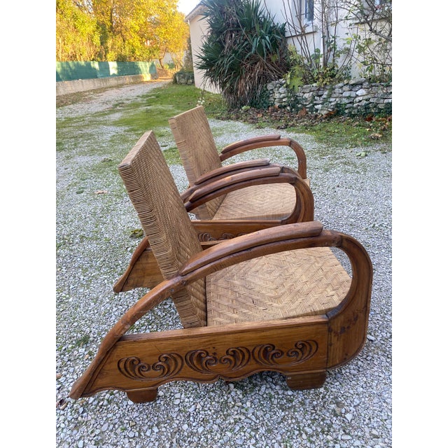 Pair of Art Deco armchairs in the colonial style rattan and teak core beautifully carved teak elements very good original...