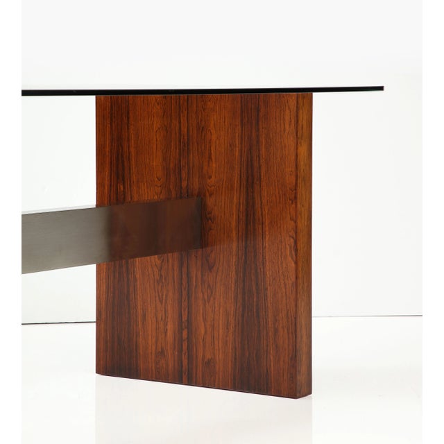 Amazing 1970s Brazilian Rosewood with aluminum stretcher desk with glass top, it can also be use as a dining table with a...