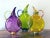 Michael Schunke Nine Iron Studios Hand-Blown Flat Art Glass Pitchers - Set of 3 Circa 2000–2007 Three jewel-colored...