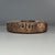 This antique Chinese circular ceramic piece is crafted from fired clay, with exquisite carved patterns on the surface. It...
