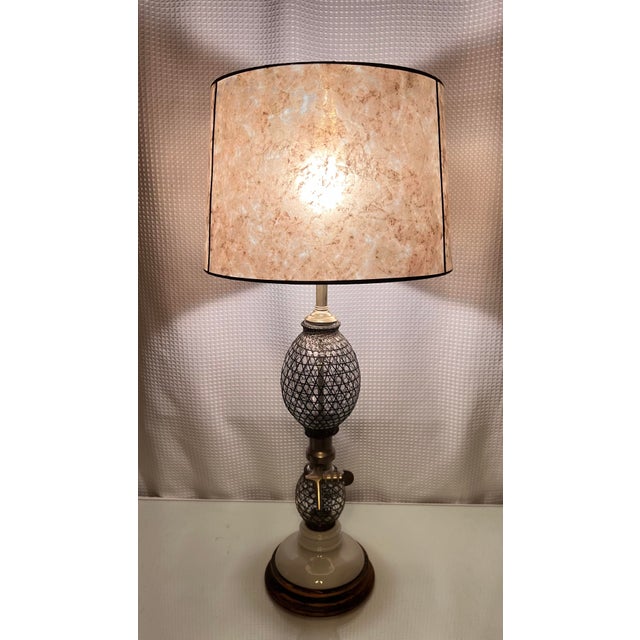 This Vintage Frederick Cooper Seltzer Bottle Table Lamp is a truly unique piece that combines industrial aesthetics with...