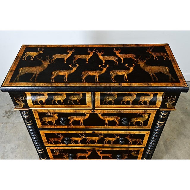 A vintage English pine chest recently updated with new paint of ebonized effect and pasted decoupage deer. The density of...