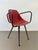 René-jean caillette "ladybug" armchair reinforced red fiberglass shell black lacquered tubular legs and armrests circa...