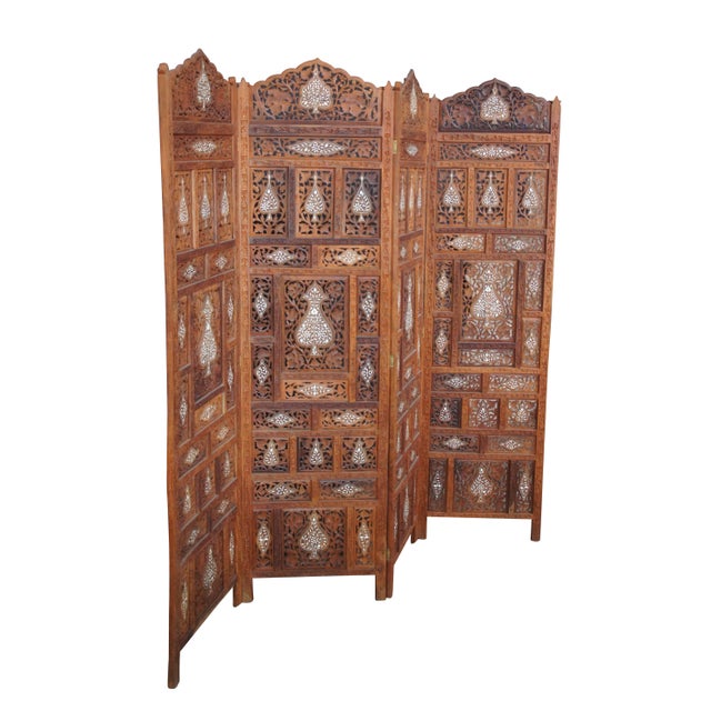 Mid-20th Century Anglo-Indian Camel Bone inlaid folding screen. Features a teak frame intricately carved and pierced with...